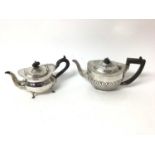 Two silver teapots