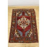 Three rugs to include a Kazak, Konya Turkey rug and Malatya rug