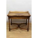 Mahogany butler's tray on stand, the quarter-veneered tray with pierced handles to the splayed galle