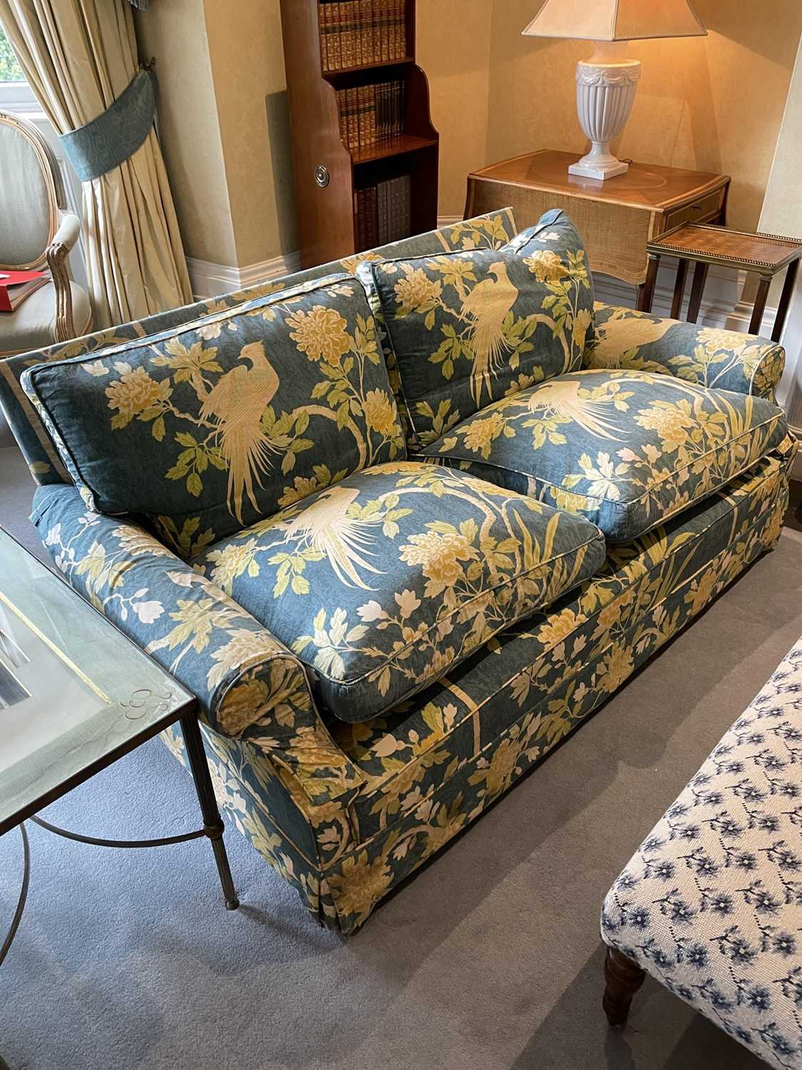 Good pair of modern sofas, each of square form with floral upholstery and castors, approximately 164