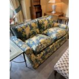 Good pair of modern sofas, each of square form with floral upholstery and castors, approximately 164