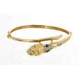 18ct gold bangle with lion's head terminal set with sapphires and diamonds
