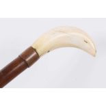19th century walking cane with marine ivory shaft, white metal collar and shaped handle, together wi
