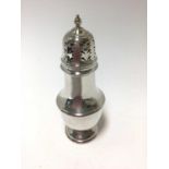Contemporary silver sugar caster of baluster form, with pierced slip in cover