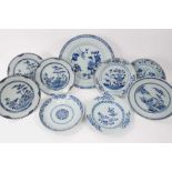 Nine Chinese blue and white export dishes, 18th century, the largest measuring 31.5cm diameter, the