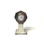 George V silver mounted dressing table clock in shaped case with hexagonal top, reeded engine turned