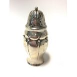 20th Century Danish silver sugar caster of baluster form with overall planished decoration applied b