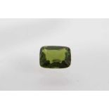 Unmounted rectangular cushion-cut green tourmaline measuring approximately 9.40mm x 7.30mm x 4.30mm