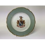 Antique porcelain plate with painted coat of arms, coronet and motto, 22.5cm diameter