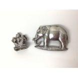 Early 20th century white metal mount of an elephant, 5cm x 3.5cm, together with an antique Indian wh