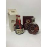 Remy Martin XO Special Fine Champagne Cognac in box together with a bottle of Grand Marnier liqueur,