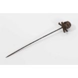 Victorian momento mori stick pin with brass skull and cross bones on a steel pin