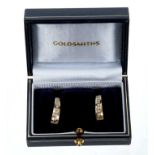 Pair of 14ct gold and diamond hoop earrings, each with a line of channel set brilliant cut diamonds