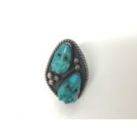 Navajo style silver ring, of lozenge form, inset with turquoise-carved frogs, approx size M