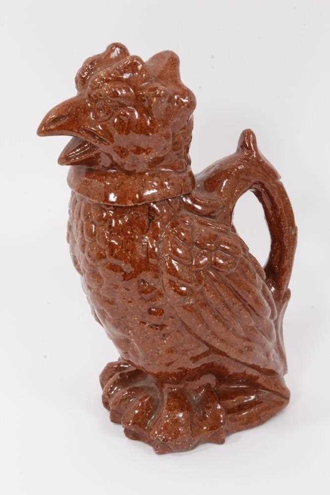 Unusual treacle glazed pottery jug in the form of a bird, 25cm high