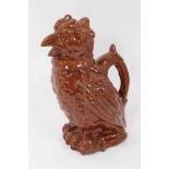 Unusual treacle glazed pottery jug in the form of a bird, 25cm high