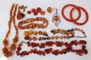 Group amber and amber type jewellery including silver mounted brooch and ring