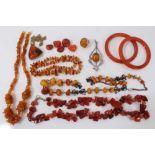 Group amber and amber type jewellery including silver mounted brooch and ring