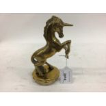 Car Radiator cap, mounted with a brass model of a rearing Unicorn, 15.5cm in height excluding base