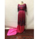 Circa 1910 Evening dress in cerise pink satin overlaid by black beaded and embroidered net. Dress h