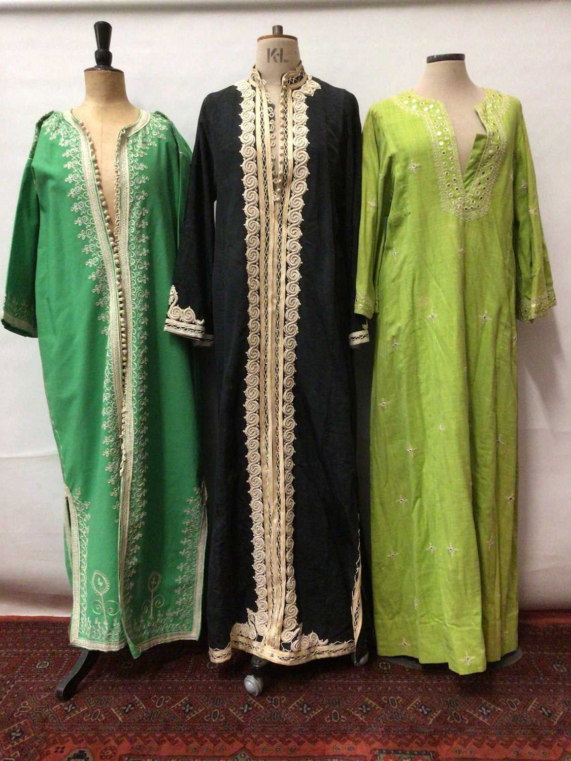 Three kaftan robes with embriodered fronts plus a long lrngth green Chinese silk brocade evening coa