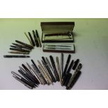 Large collection of over 30 fountain and ball point pens together with propelling pencils to include