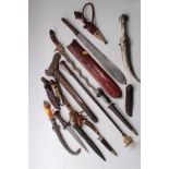 Old Arab white metal mounted and amber hilted Jambia and collection of daggers