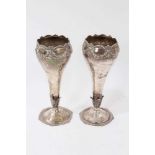 Pair silver vases of tapering form with floral swag decoration