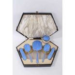 1930s Art Deco five piece silver dressing table set, comprising a hand mirror and four brushes with