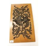 Group of Indonesian carved wood panels together with printing blocks
