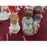 Lisa Larson ceramic figure of a baby, together with a similar group of two children possibly by the