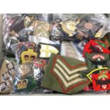 Large collection of British and American military cloth badges (1 box)