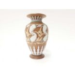 Single terracotta colour single vase decorated with white foliage