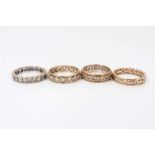 Four 9ct gold synthetic white stone eternity rings