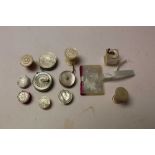 Twelve mostly Victorian mother of pearl sewing accessories, including tape measures, waters, pin cus