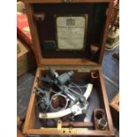 Hezzanith sextant in original case together with a pair of military binoculars in leather case