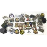 Large collection of British and American military cloth badges (1 box)