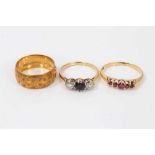 18ct gold sapphire and diamond three stone ring, garnet five stone ring and 18ct gold wedding ring