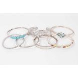 Seven contemporary silver paste and gem set bangles