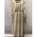 c1910 Girl’s embroidered silk dress with pearl beading. An Edwardian cotton and lace petticoat, cot