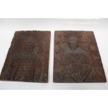 Pair of continental carved oak plaques, with portraits of a man and woman in relief, 35.5cm high