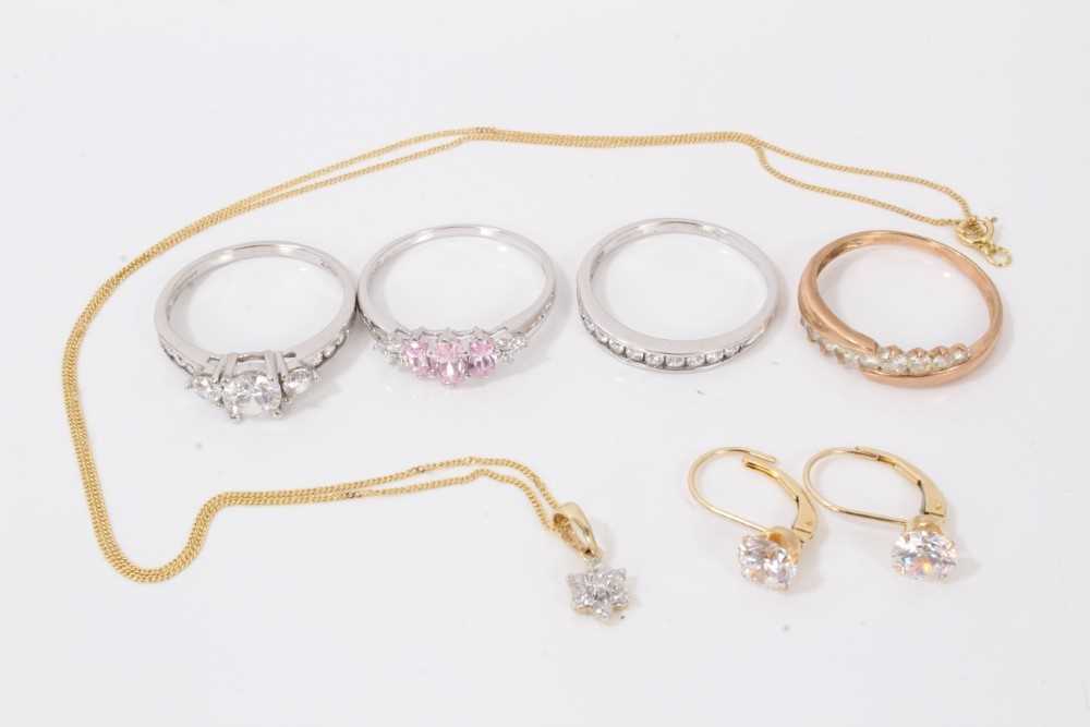 Group of 14ct gold to include three white gold gem set dress rings, rose gold gem set dress ring, pa