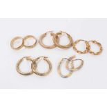 Two 9ct gold wedding rings and four pairs 9ct gold hoop earrings