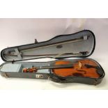 Old violin and two bows in case
