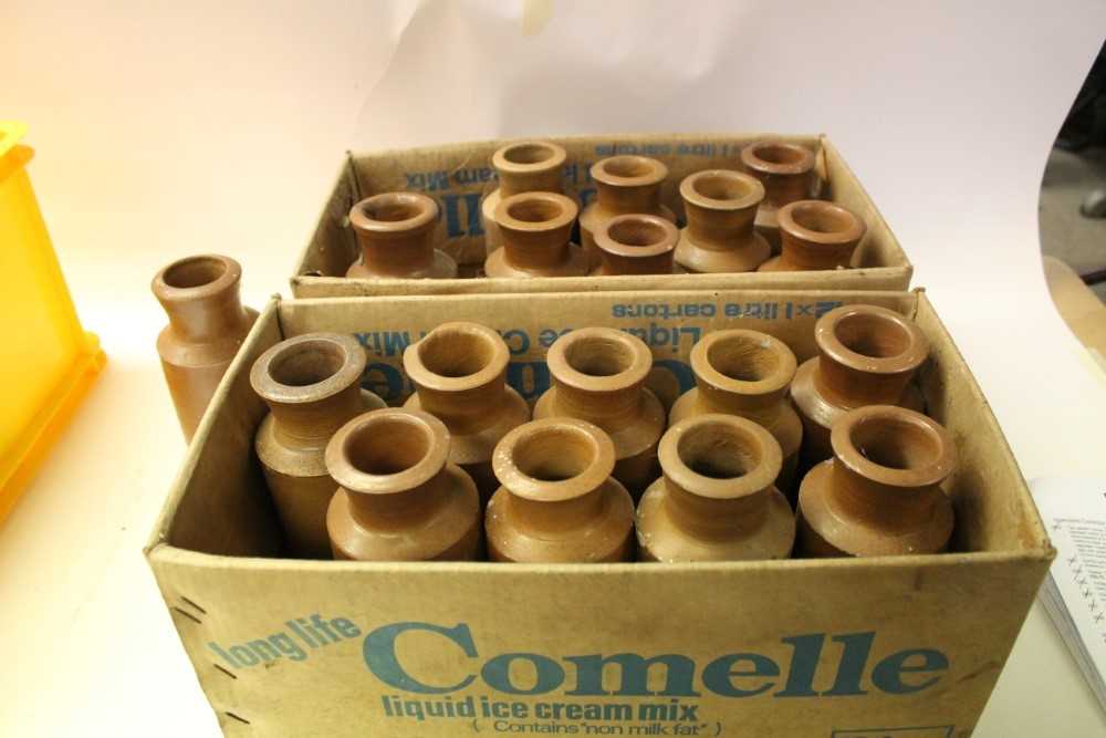 Two boxes of stoneware bottles, a runner bean slicer and group of table knives