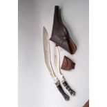 Very large Gurkha Kukri, the blade 51cm in length marked India, together with another Kukri, brown l