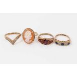 Four 9ct gold rings to include 1970s sapphire and diamond five stone ring in carved scroll setting,