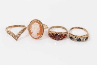 Four 9ct gold rings to include 1970s sapphire and diamond five stone ring in carved scroll setting,