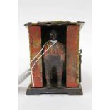 Antique novelty pay money box modelled as Uncle Tom's Cabin, patent date of 1885 to base, 9.5cm high