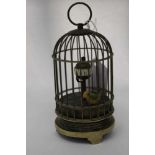 Novelty clock in the form of bird in a cage